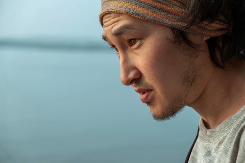 Side View Of Young Man Against Sea