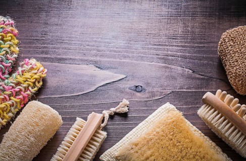 Set of bath accessories on wooden board