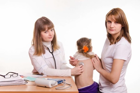 Pediatrician listening stethoscope baby's back, which keeps mum