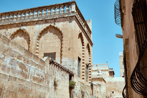 Traditional middle eastern stone houses on a street of Middle Eastern city. Streets of Mardin,