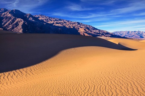 Mesquite Flat Sand Dunes. Bright solar morning in picturesque part of Death Valley. Slopes of sandy