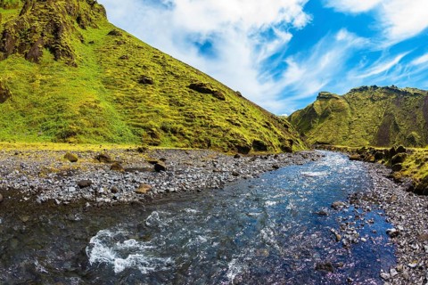 The canyon Pakgil fast flowing shallow stream. Scenic summer Iceland. The photo was taken Fisheye