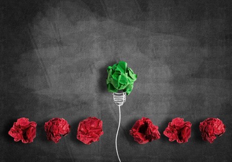 Inspiration concept with crumpled paper light bulb as good idea