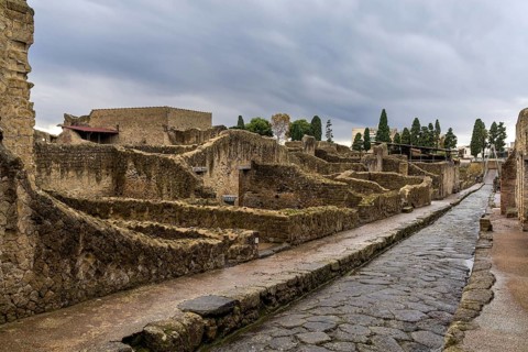 Ercolano, Italy, 25 November, 2023: typical city street and houses in the ancient Roman town of