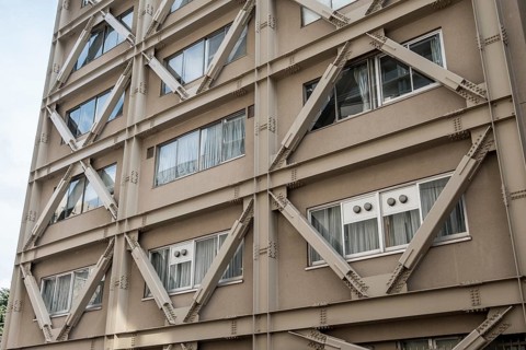Building with visible steel reinforcement for earthquake resistance