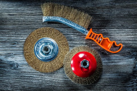 Used crimped wire brushes on vintage wooden board