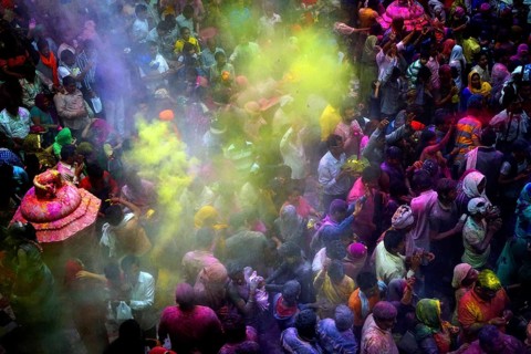 People throwing colored powder Banke Bihari Temple, Uttar Pradesh, India, Asia