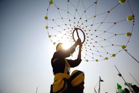 Young Nihangs Sikh warrior performing traditional martial art Gatka consecration perpetual Guru