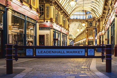 London Leadenhall Market entrance showcases stunning Victorian architecture, warm lighting, and