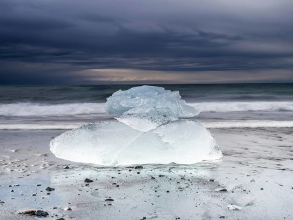 Diamond Beach, iceberg in the surf on the black lava beach, near Jökulsarlon glacier lagoon,