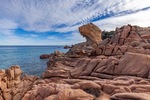 Coastal landscape with bizarre red rocks and sea view, Spiaggia di Cala E'Luas, Ogliastra,