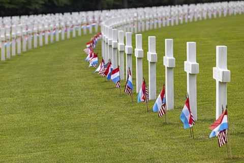 White crosses with Luxembourgish and American flags at a cemetery, Luxembourg American Cemetery and