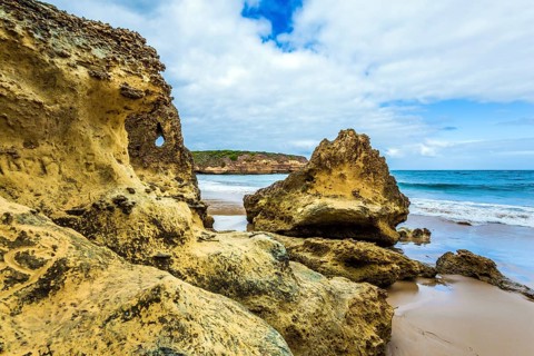 Picturesque coastal cliffs and a powerful surf of the Pacific Ocean. The Great Ocean Road of