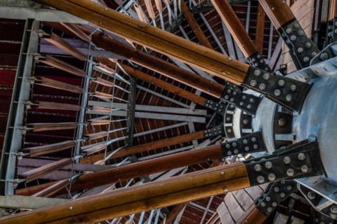 View of wooden observation tower taken from ground level looking up through levels of structure in