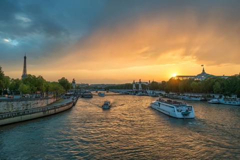 Paris France, city skyline sunset at Seine River with Pont Alexandre III bridge and Grand Palais
