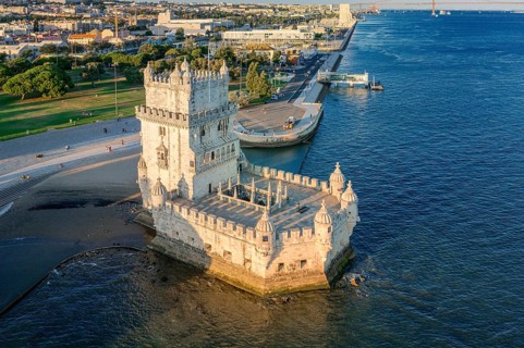 Drone view of Belem tower and its surroundings, Lisbon, Portugal at summer day. Medieval