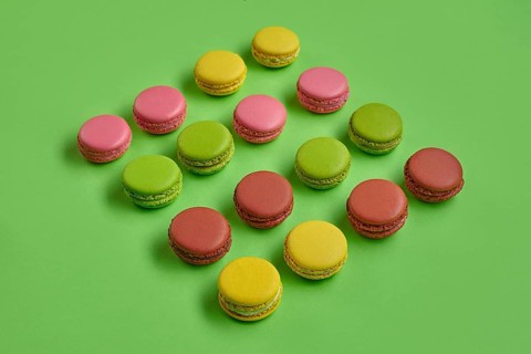 Top view of a yummy macarons or macaroons, sweet meringue-based confection with a ganache,
