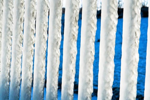 Huge icicles, icing on the sea pier