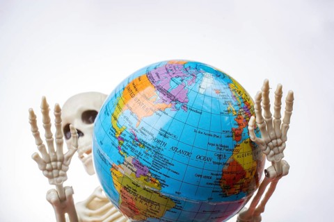 The earth in a skeleton hand