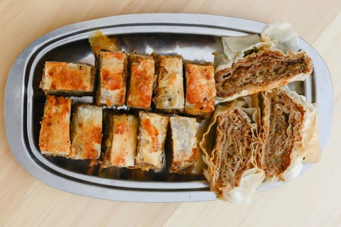 Traditional serbian cake baklava arranged on metal plate for serving on Saint day