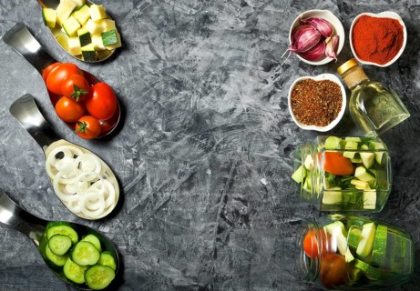 Vegetables on the background. Fresh vegetables (cucumbers, tomatoes, onions, garlic, dill, green