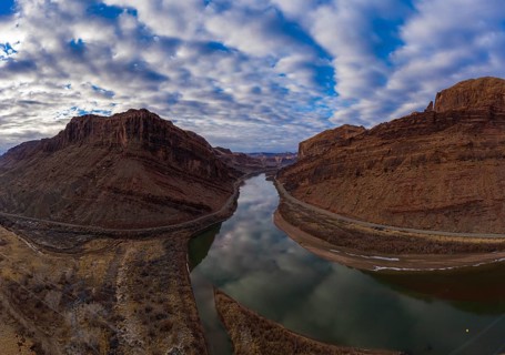 Colorado River and Red Sandstone Mountains on Cloudy Morning. Sky Reflection in Water. Grand