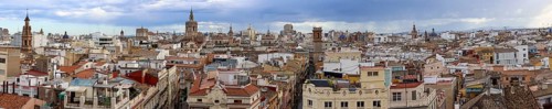 Panoramic photo of the rooftops of Valencia with the towers of the city's churches, as well as the