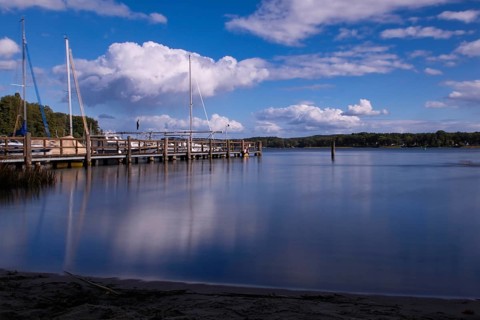 View over the Scharmützelsee with jetty and marina, long exposure, Wendisch-Rietz, Brandenburg,