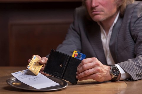 Man in suit pays the bill with credit card, Mindelheim, Bavaria, Germany