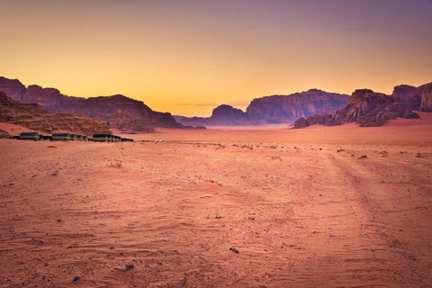 Dramatic Wadi Rum desert scene during sunset