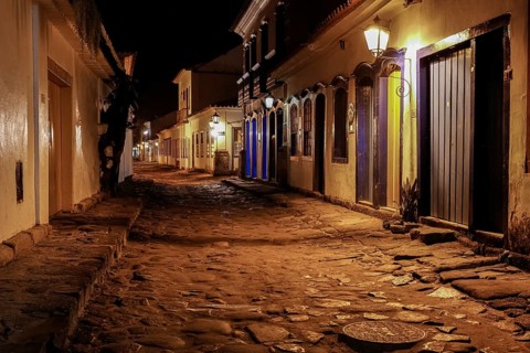 Atmospheric night view of illuminated street and buildings in historical center of Paraty, Brazil,