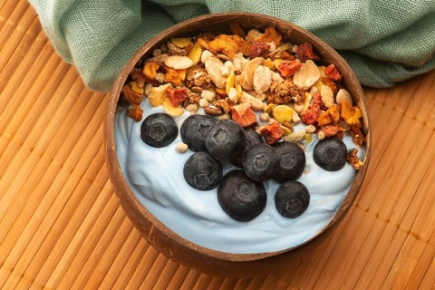 Healthy breakfast concept with flakes, blue spirulina and fresh berries