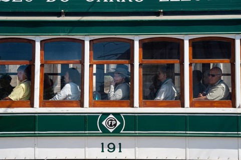 14.06.2018, Porto, Portugal, Europe, Tourists look out of the window during a tram tour through