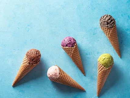 Various ice cream scoops in cones with copy space. Colorful ice cream in cones chocolate,
