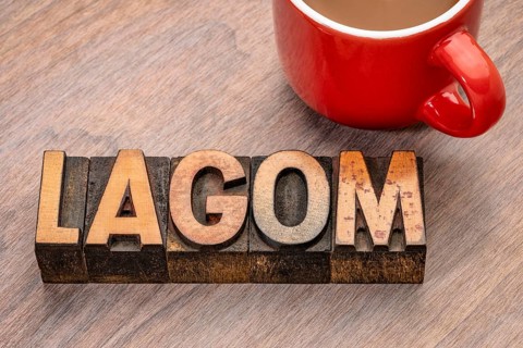 Lagom word abstract in vintage letterpress wood type blocks, Swedish balanced lifestyle concept