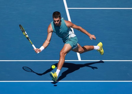 Spanish tennis player Carlos Alcaraz (ESP) playing forehand shot at Australian Open 2025