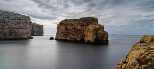 Long exposure landscape view of Dwejra Bay and Ufo Rock on Gozo Island in Malta