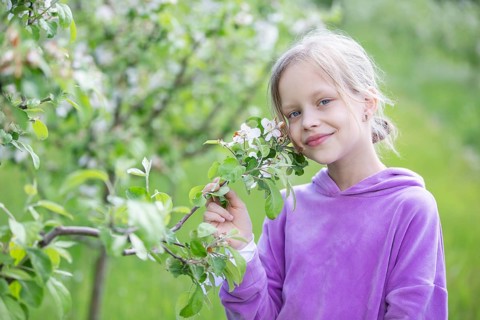 May 27, 2021. Belarus, Gomel, Public event.A beautiful little blonde woman poses in a spring garden
