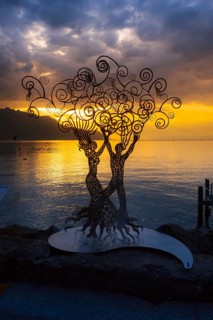 Montreux, Switzerland, October 12, 2019: Metal figure of a woman and man at promenade of Geneva
