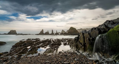 A long expiosure view of the Playa de Gueirua beach on the Costa Verde of Asturias