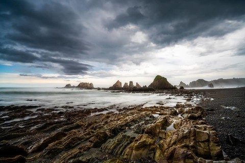 A long expiosure view of the Playa de Gueirua beach on the Costa Verde of Asturias