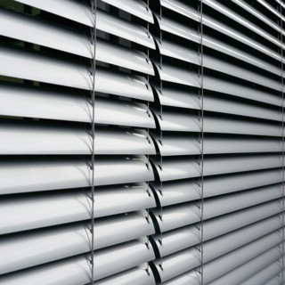 Venetian blind as sun protection on the window of a B