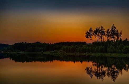 Sunset at the lake in the Harz Mountains