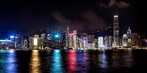 HONG KONG, CHINA - SEPTEMBER 27 2024: Night time view of Hong Kong Island and Victoria Harbour from