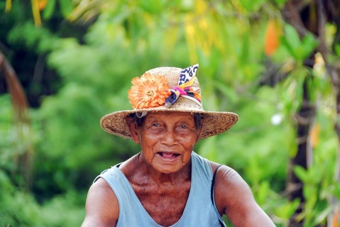 Portrait of a balinese old woman looking at camera