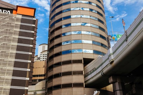 OSAKA, JAPAN - SEPTEMBER 25 2024: The famous 'highway thru a building'. The off ramp for the Umeda