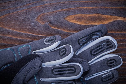 Working safety gloves on wood board gardening concept
