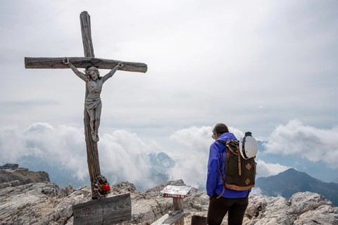 The beautiful old wooden summit cross of Mount Lagazuoi in the Dolomite Alps, autonomous province