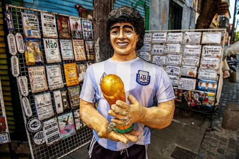 Statue of Diego Maradonna with football World Cup trophy in La Boca, Buenos Aires, Argentina