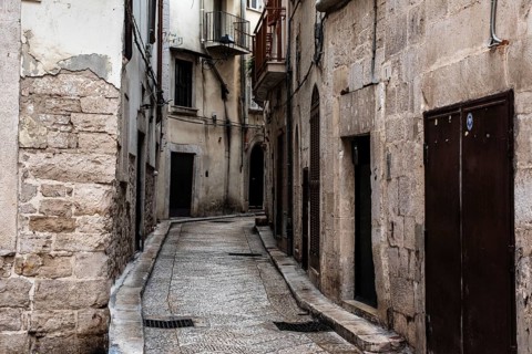 Old ancient typical alleyway in the Italian town of Trani, Southern Italy